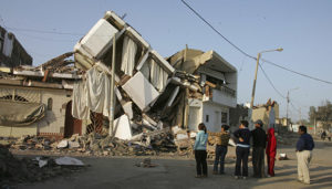 (NYT76) PISCO, Peru -- Aug. 17, 2007 -- PERU-QUAKE-13 -- People look at destroyed property in Pisco, Peru, Friday, August 17, 2007. No area along the southern coast of Peru, which was ravaged by an earthquake that killed at least 510 people, was harder hit than the port city of Pisco.  (Ana Cecilia Gonzales-Vigil/The New York Times)